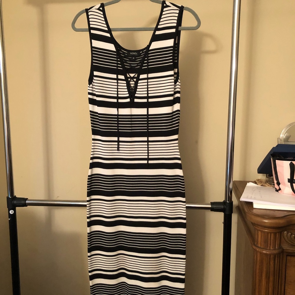 This is a long stripped tight fitted dress.